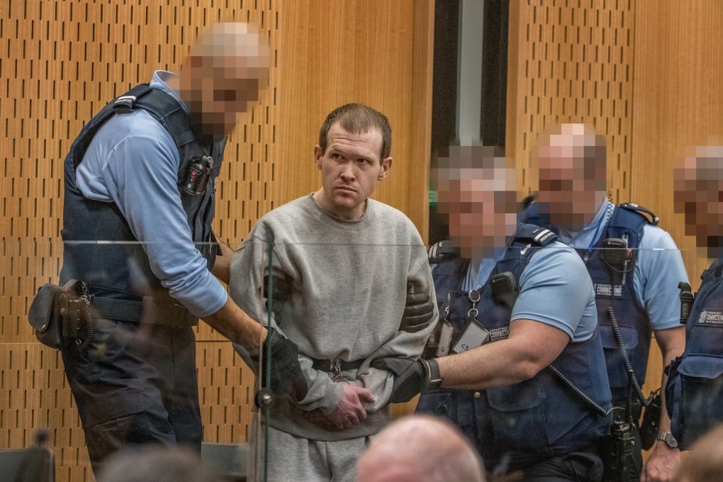 Christchurch mosque attack gunman Brenton Tarrant (2-L) listens to victim impact statements during a hearing at the High Court in Christchurch, New Zealand, 25 August 2020. Photo: EPA-EFE