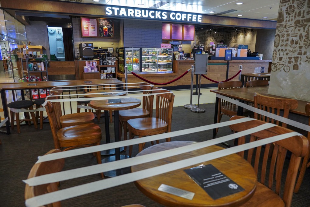 Tables and chairs are taped to effect social distancing at a Starbucks coffee shop in Kornhill, Quarry Bay in 2020. Photo: Robert Ng