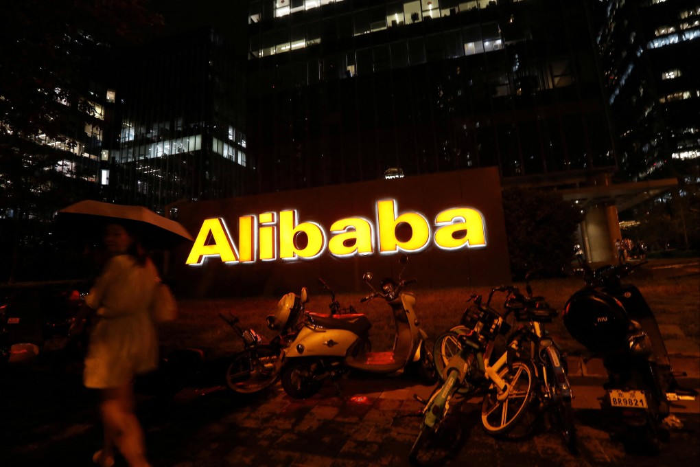 The logo of Alibaba Group is seen lit up at its office building in Beijing, China. Photo: Reuters
