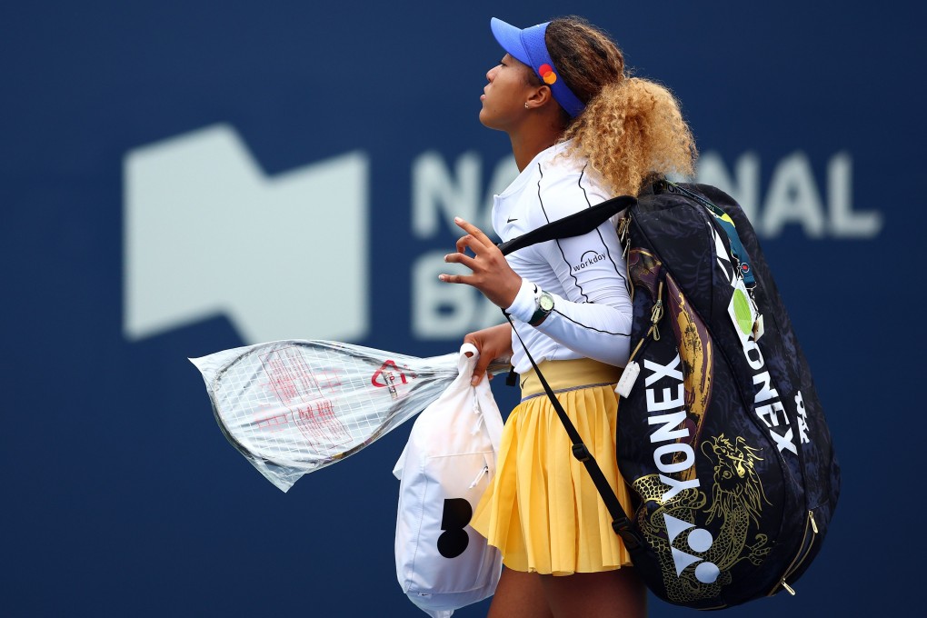 Naomi Osaka walks off court retiring from her match against Kaia Kanepi. Photo: AFP