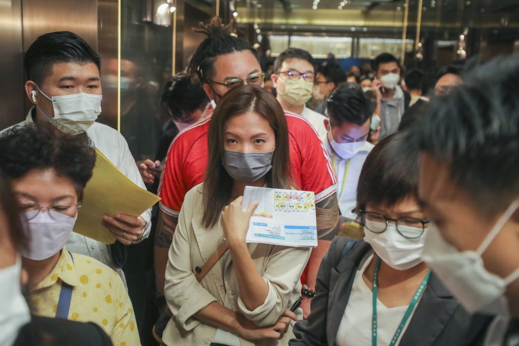 Buyers line up at Henderson Land’s sales office in Tsim Sha Tsui on Wednesday for its upcoming One Innovale-Archway residential development in Fanling. Photo: Xiaomei Chen