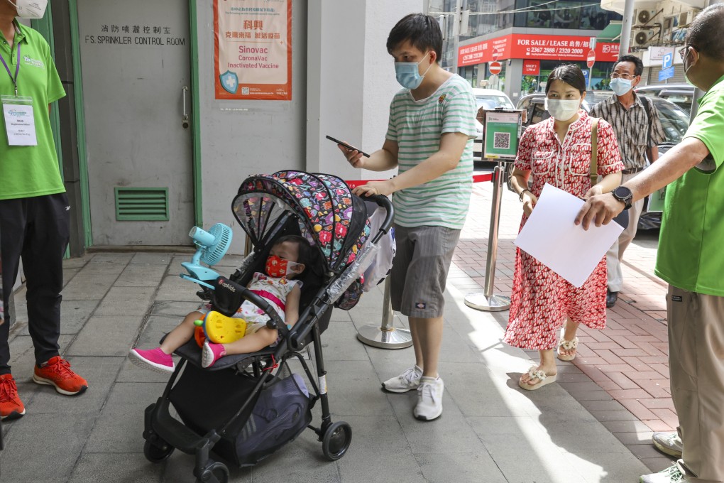 A father in Hong Kong brings his toddler for vaccination at Kwun Chung Municipal Services Building. Photo: Edmond So