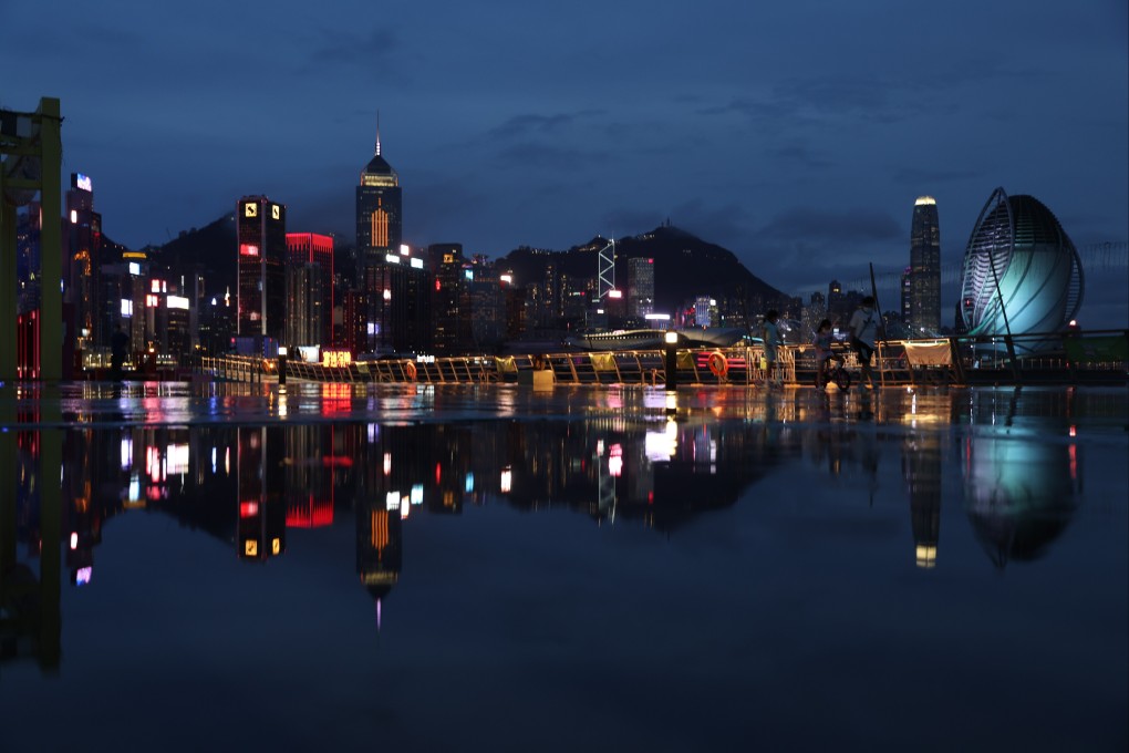 Commercial and residential buildings on Hong Kong Island are reflected on the ground at East Coast Park Precinct in Causeway Bay on August 5. Photo: Yik Yeung-man