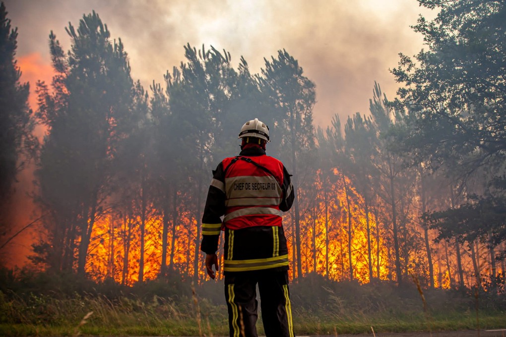 A firefighter works to contain a fire that broke out near Landiras, as wildfires continue to spread in the Gironde region of southwestern France. Photo: SDIS 33/Handout via Reuters/File