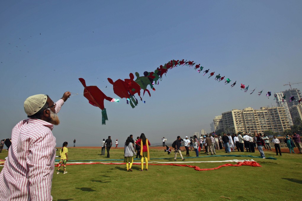 A participant flies a kite at a kite festival in India. File photo: AP