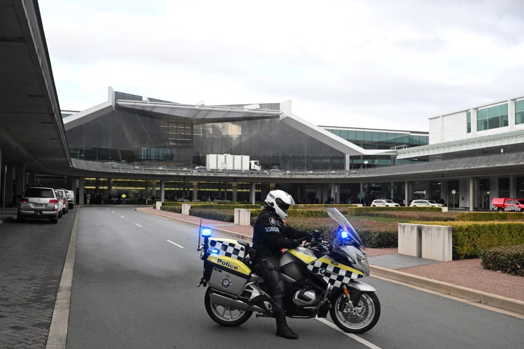 Australian Federal Police gather at Canberra Airport after a man fired at least three gunshots on August 14. The airport was evacuated and a man was arrested in relation to the event, with police confirming there have been no reported injuries. Photo: EPA-EFE