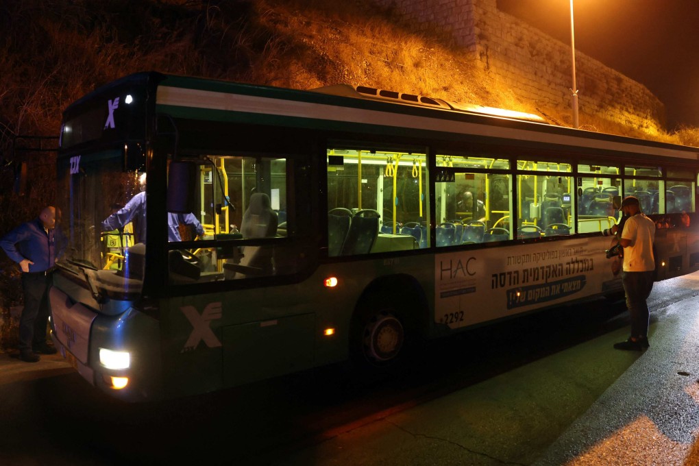Israeli security inspect a bus after an attack outside Jerusalem’s Old City on Sunday. Several people were injured, two of them critically. Photo: AFP