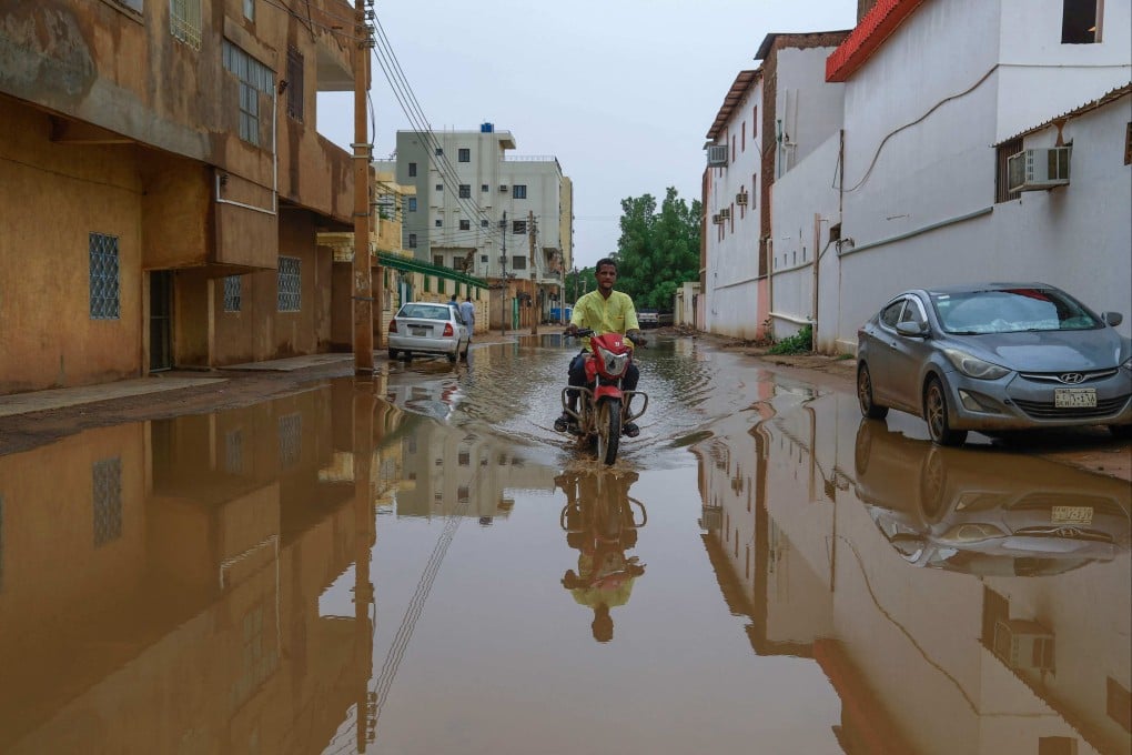 A man rides a motorbike following heavy rain in Sudan’s capital Khartoum on Saturday. Photo: AFP