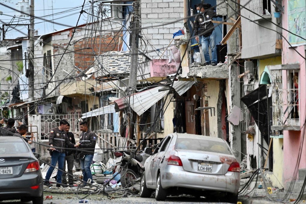 Police inspect the site of an explosion in southern Guayaquil, Ecuador on Sunday. Photo: AFP