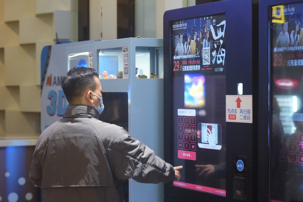 A man buys a film ticket at a cinema in Hangzhou, Zhejiang province. Photo: Getty Images