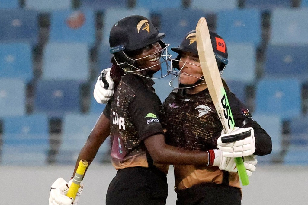 Tornadoes’ captain Stafanie Taylor (left) celebrates with teammate Sune Luus after their win in the FairBreak Invitational 2022 women’s final at the Dubai International Cricket Stadium on May 15, 2022. Photo: AFP