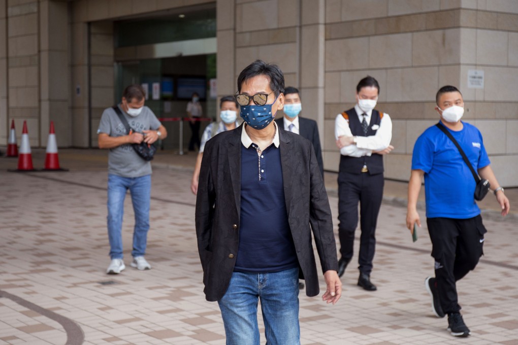 Defendant Ching Wai-ming (centre) leaves the court building on Monday. Photo: Brian Wong