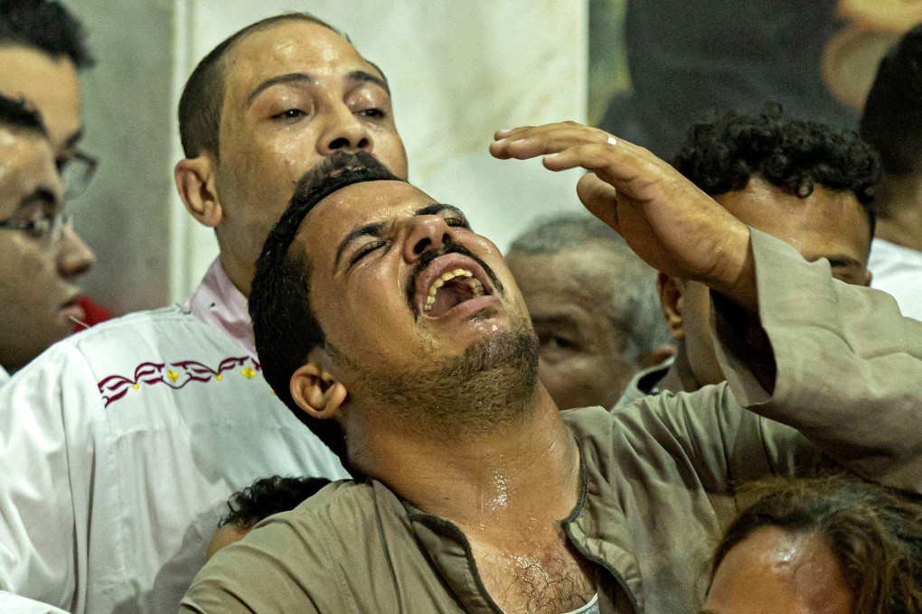 Egyptian mourners at the funeral of victims killed in a Cairo Coptic church fire, at the church of the Blessed Virgin Mary in the Giza Governorate on Sunday. Photo: AFP