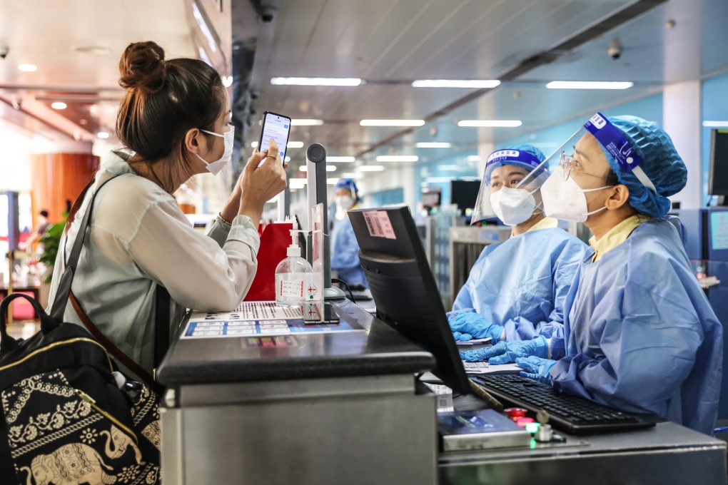 A stranded tourist checks in at Haikou Meilan International Airport on August 14. Photo: Xinhua