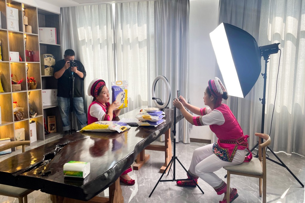 A woman from Hunan in traditional Bai clothing selling locally-grown fragrant rice on Douyin, the Chinese version of TikTok. Photo: Luna Sun
