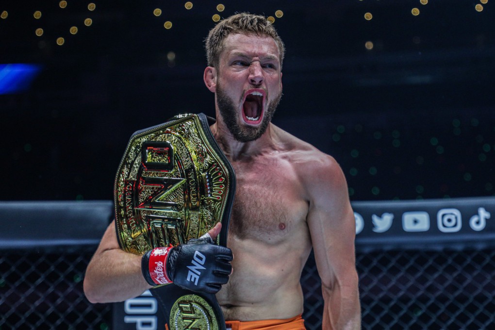 Reinier de Ridder celebrates with his middleweight title after submitting Vitaly Bigdash at ONE 159. Photo: Handout