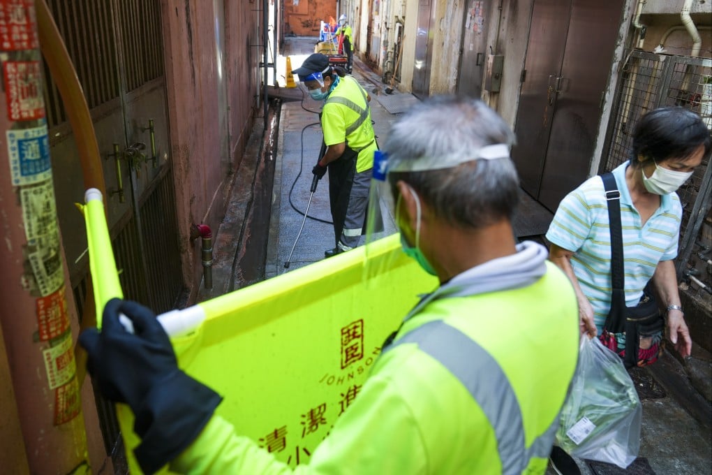 Contractors workers clean an alley in Prince Edward. The Hong Kong government has identified more than 600 black spots in the city to undergo a hygiene boost. Photo: Sam Tsang