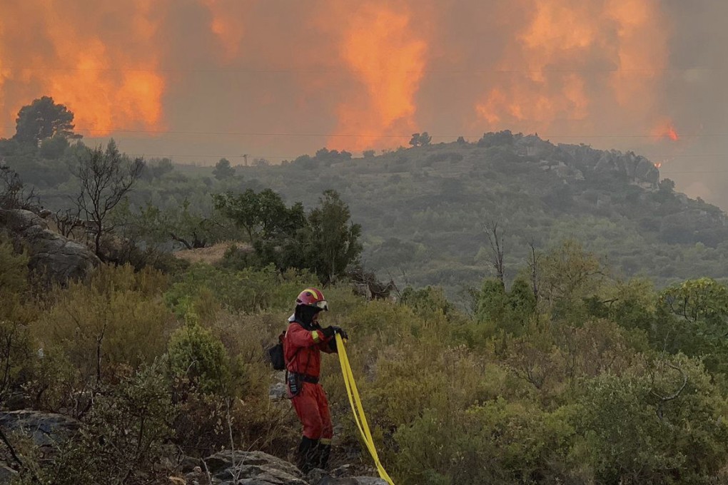 Firefighter to extinguish a forest fire in Useres, eastern Spain on Monday. Researchers said that climate change was likely a “major driver” in increased fire activity. Photo: AP