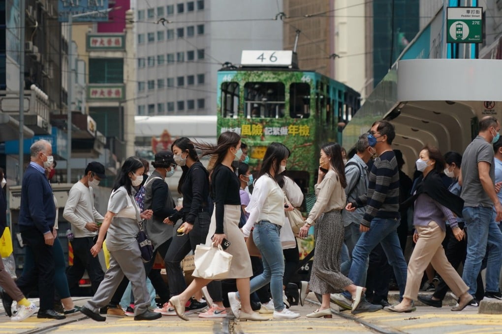 People head to work in Central on March 30. Cultures have different ideas about women’s role in the family and society. Photo: Felix Wong