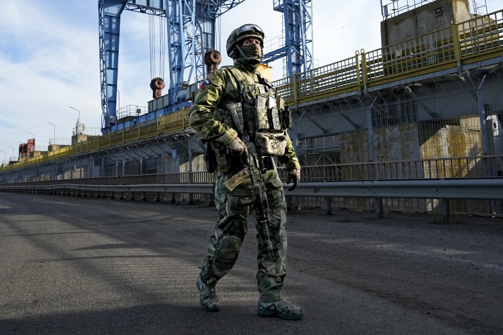 A Russian soldier patrols an area at the Kakhovka Hydroelectric Station in the Kherson region, southern Ukraine. File photo: AP