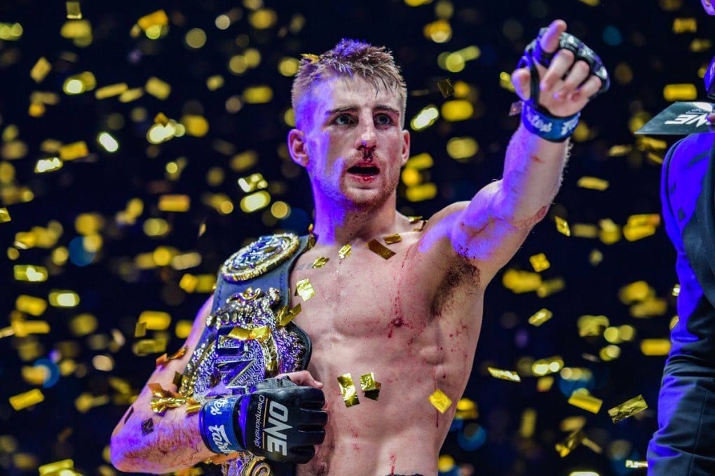 Jonathan Haggerty poses with the ONE flyweight Muay Thai title. Photos: ONE Championship