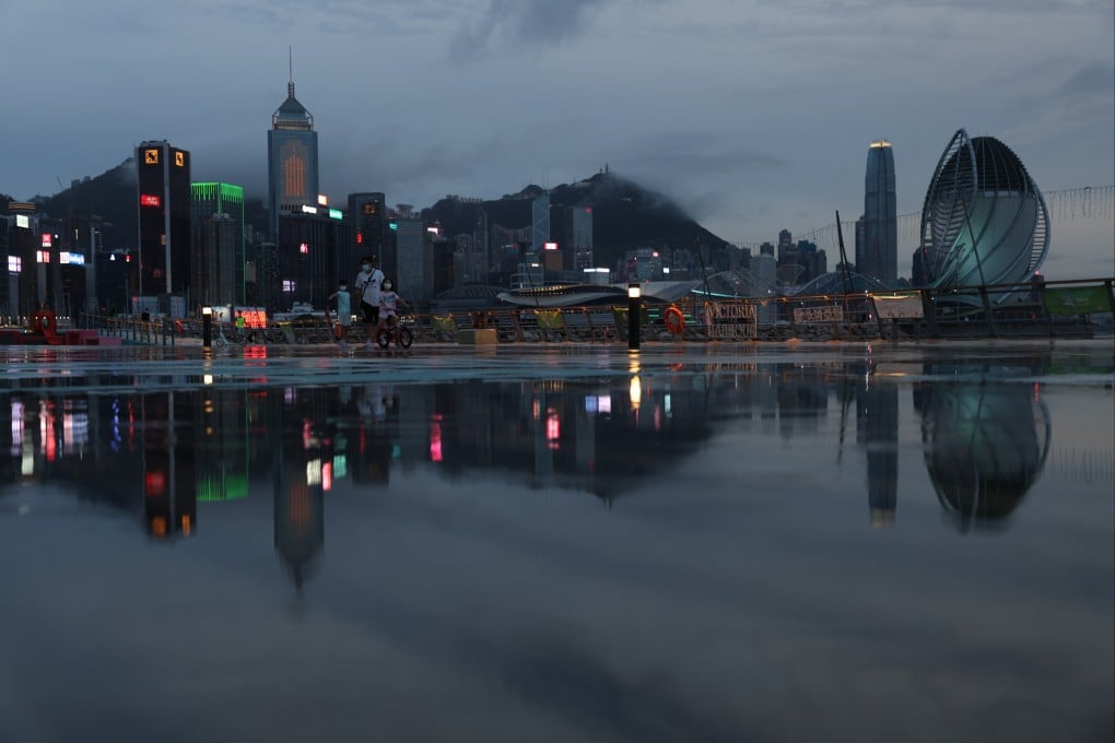 Commercial and residential buildings on Hong Kong island are reflected on the ground at East Coast Park precinct in Causeway Bay on August 5. Photo: Yik Yeung-man