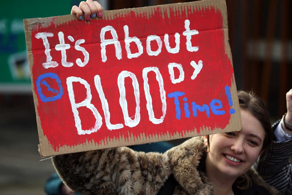 A supporter of the Period Products bill at a rally outside parliament in Edinburgh in November 2020. Photo: DPA
