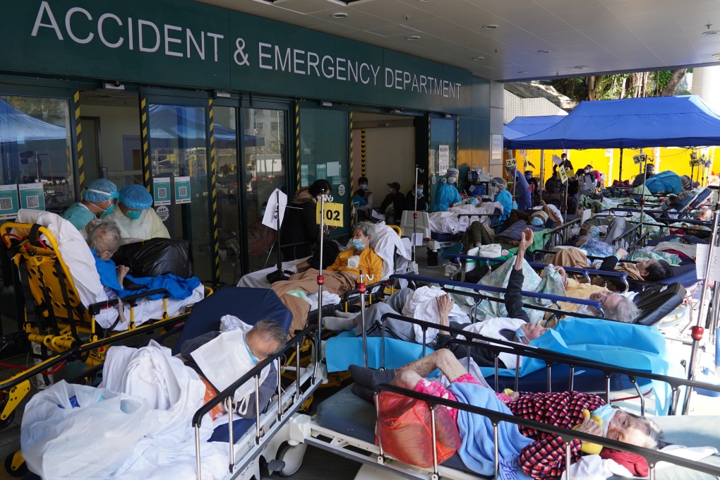 Patients with Covid-19 symptoms waiting in a temporary holding area outside the Accident & Emergency Department of Caritas Medical Centre in Cheung Sha Wan on February 27. Photo: Sam Tsang