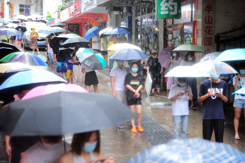 Residents and tourists queue for Covid tests in Hainan earlier this month. Photo: AFP