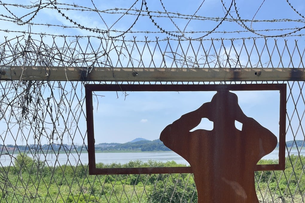 Barbed wire and fences are common on the Pyeonghwa Nuri-gil bike path, in South Korea along the Demilitarised Zone, but the route also meanders through farmland, past rice paddies, rivers and wildlife. Photo: Matthew C. Crawford