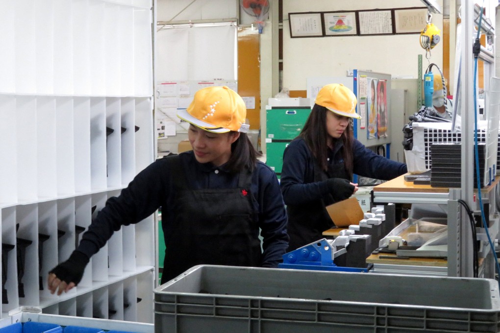 Foreign technical trainees work at a car parts factory in Akitakata, western Japan. File photo: Reuters