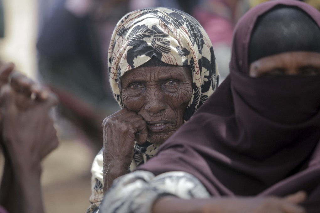 Villagers gather during a visit by World Food Programme chief David Beasley, in the village of Wagalla in northern Kenya. Photo: AP