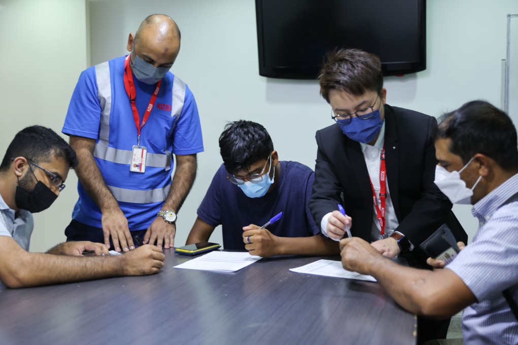 Jobseekers fill out forms at KMB’s recruitment event at the Kowloon Mosque and Islamic Centre in Tsim Sha Tsui. Photo: Yik Yeung -man