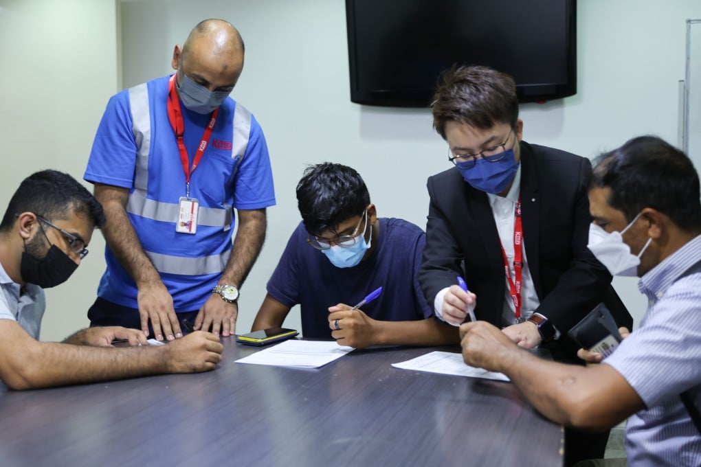 Jobseekers fill out forms at KMB’s recruitment event at the Kowloon Mosque and Islamic Centre in Tsim Sha Tsui. Photo: Yik Yeung -man