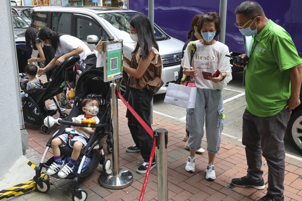 Residents line up at a community vaccination centre to receive Covid-19 jabs. Photo: Edmond So
