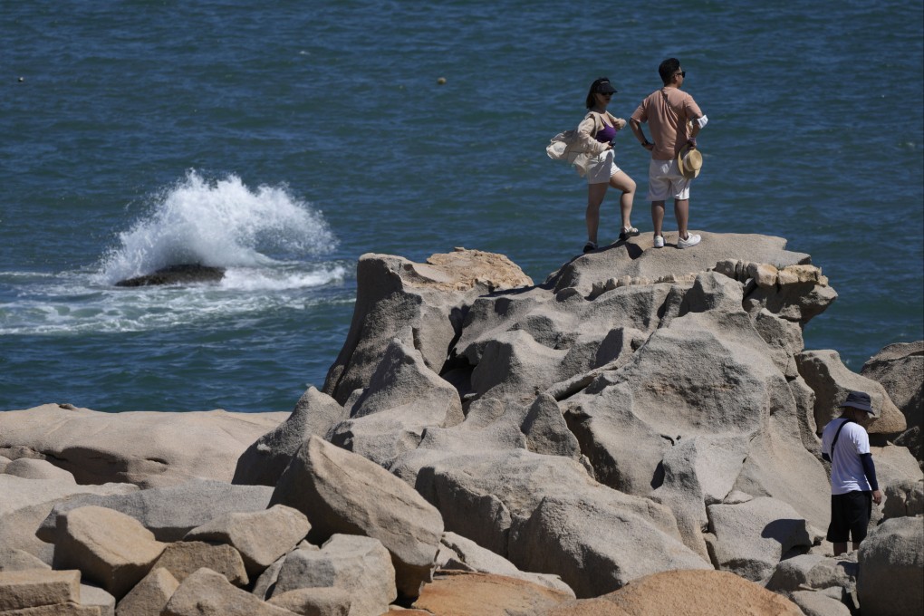 Tourists in mainland China visit a scenic area in southeastern   Fujian province marked as the closest spot to the island of Taiwan. Photo: AP