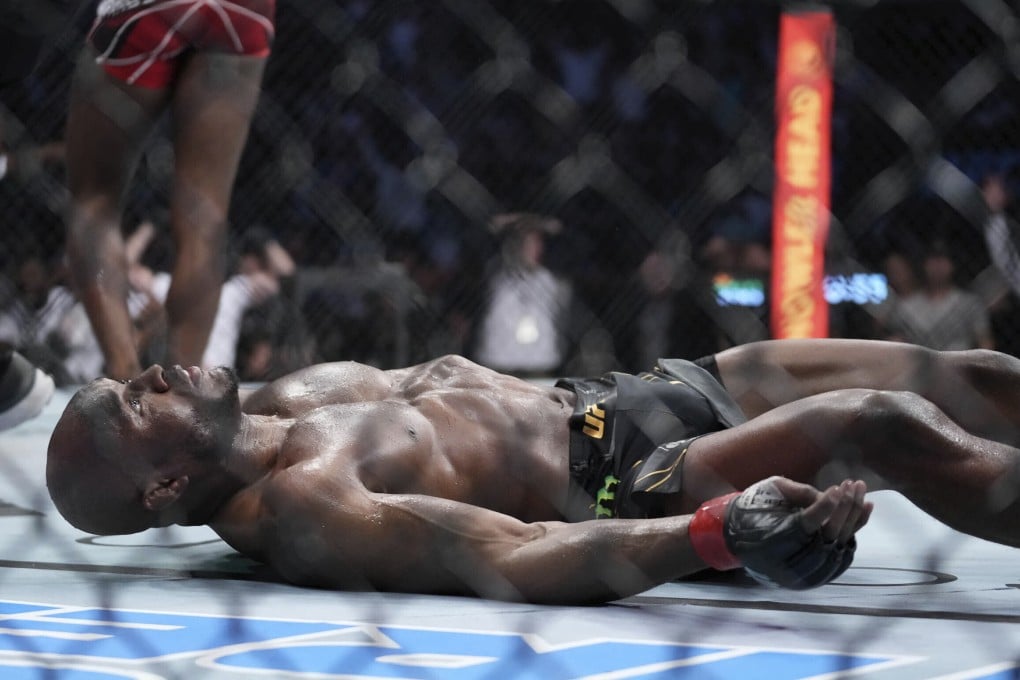Kamaru Usman lays on the canvas after getting knocked out by Leon Edwards at UFC 278. Photo: AP