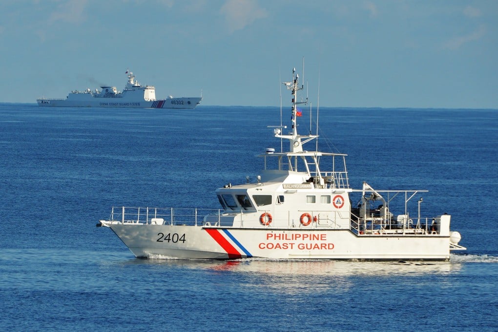 A Philippine coast guard ship sails past a Chinese coast guard vessel near the Scarborough Shoal in the South China Sea on May 14, 2019. File photo: Getty Images/TNS