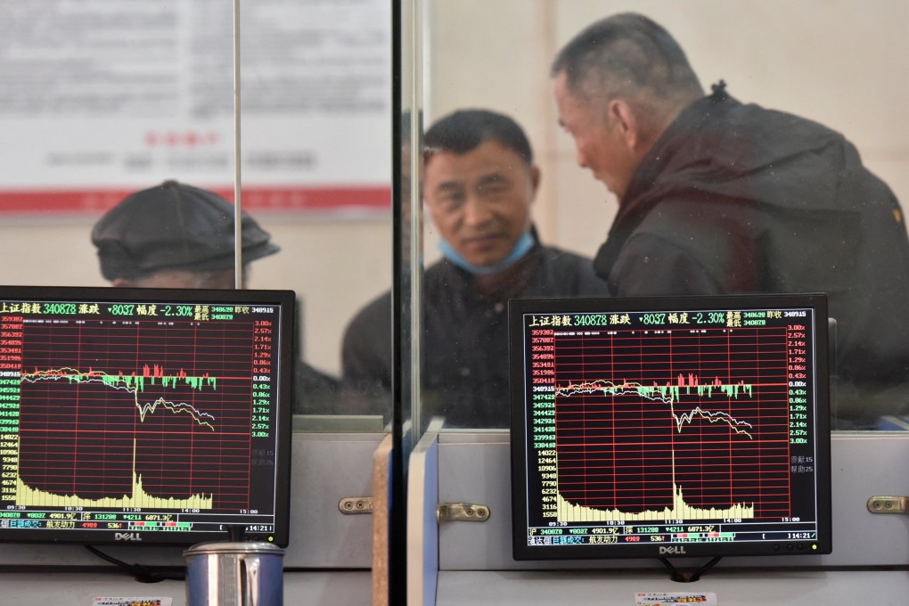 Investors talking about markets inside a brokerage in Anhui province in February 2022. Photo: Reuters