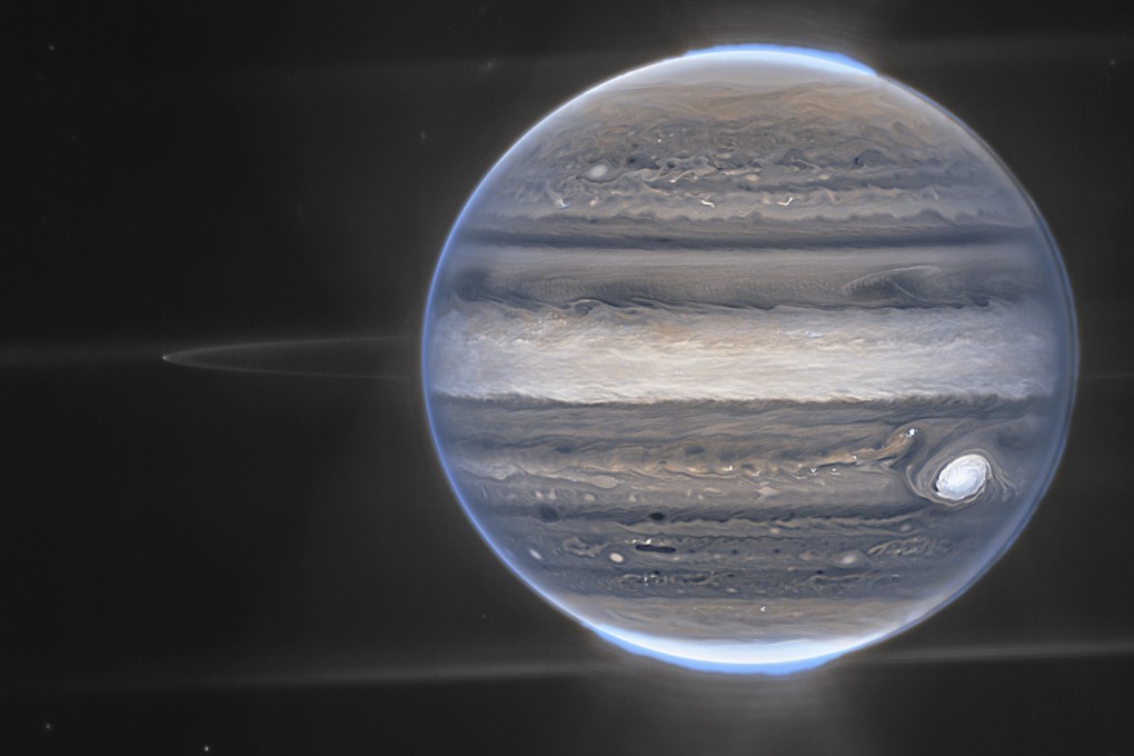 This image provided by NASA shows a false color composite image of Jupiter obtained by the James Webb Space Telescope on July 27, 2022. The planet’s rings and some of its small satellites are visible along with background galaxies. Photo: NASA via AP