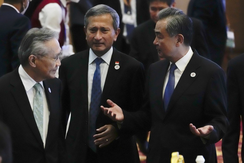 Foreign Minister Wang Yi (right) chats with Singapore’s Foreign Minister Vivian Balakrishnan (centre) and Thailand’s Foreign Minister Don Pramudwinai as they arrive at the Asean-China Ministerial Meeting at a hotel in Phnom Penh, Cambodia, on August 4. Photo: AP