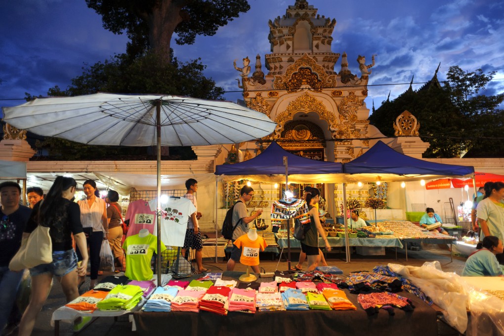 Tourists visit a Sunday market in Chiang Mai, Thailand. Photo: Shutterstock