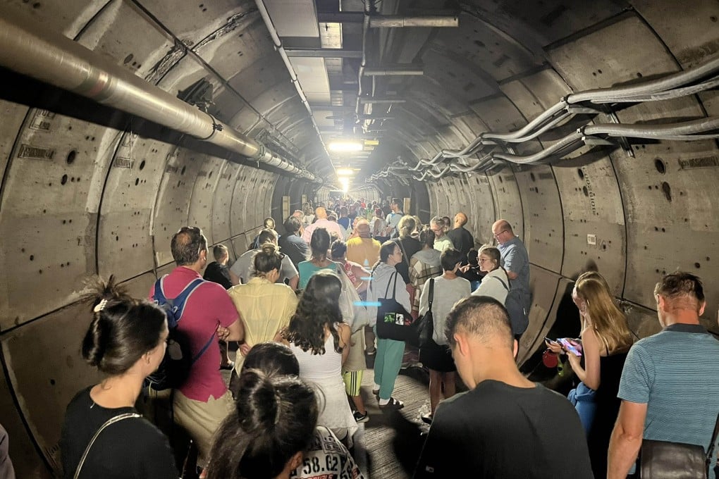 Passengers were escorted through the emergency tunnel of the Eurotunnel between France and England after one of the trains broke down. Photo: PA/Handout: Twitter