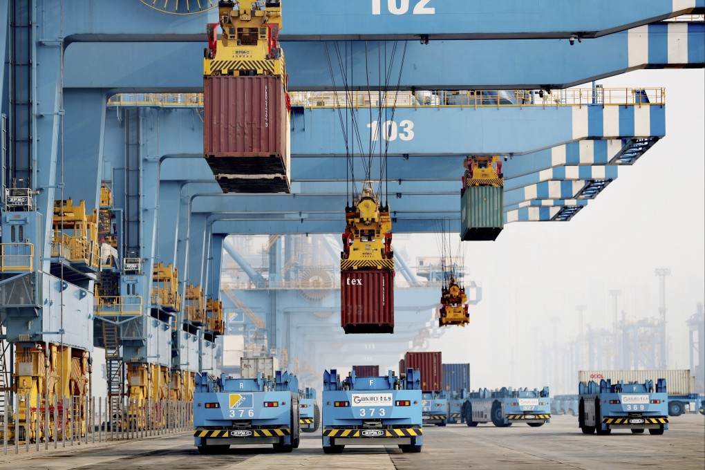 Driverless vehicles move shipping containers at a port in Qingdao in eastern China’s Shandong province. Photo: AP
