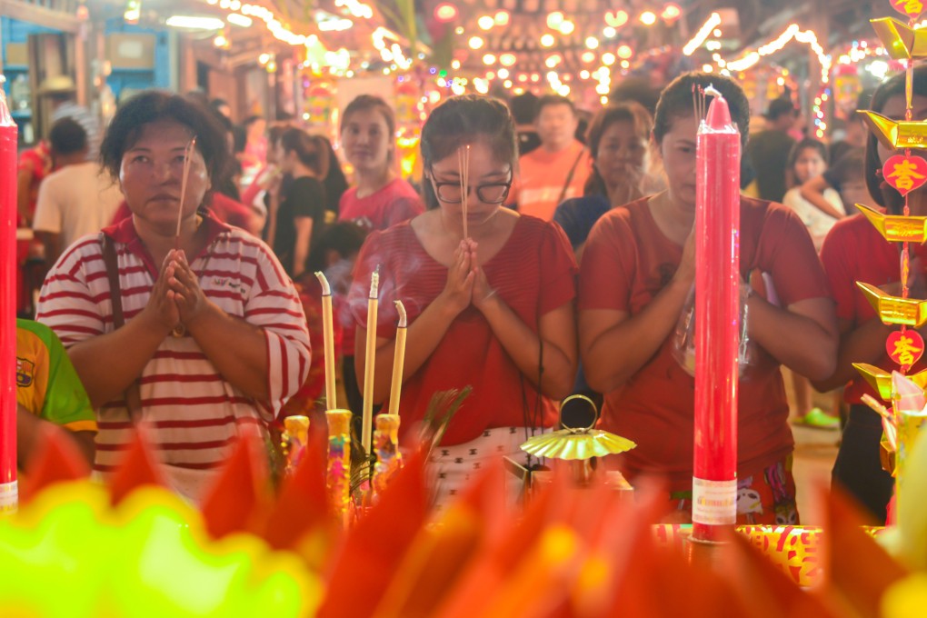 People praying in Thailand in 2016 during the Moon Praying Festival. The Mid-Autumn Festival is celebrated in many different ways outside China. Photo: Shutterstock