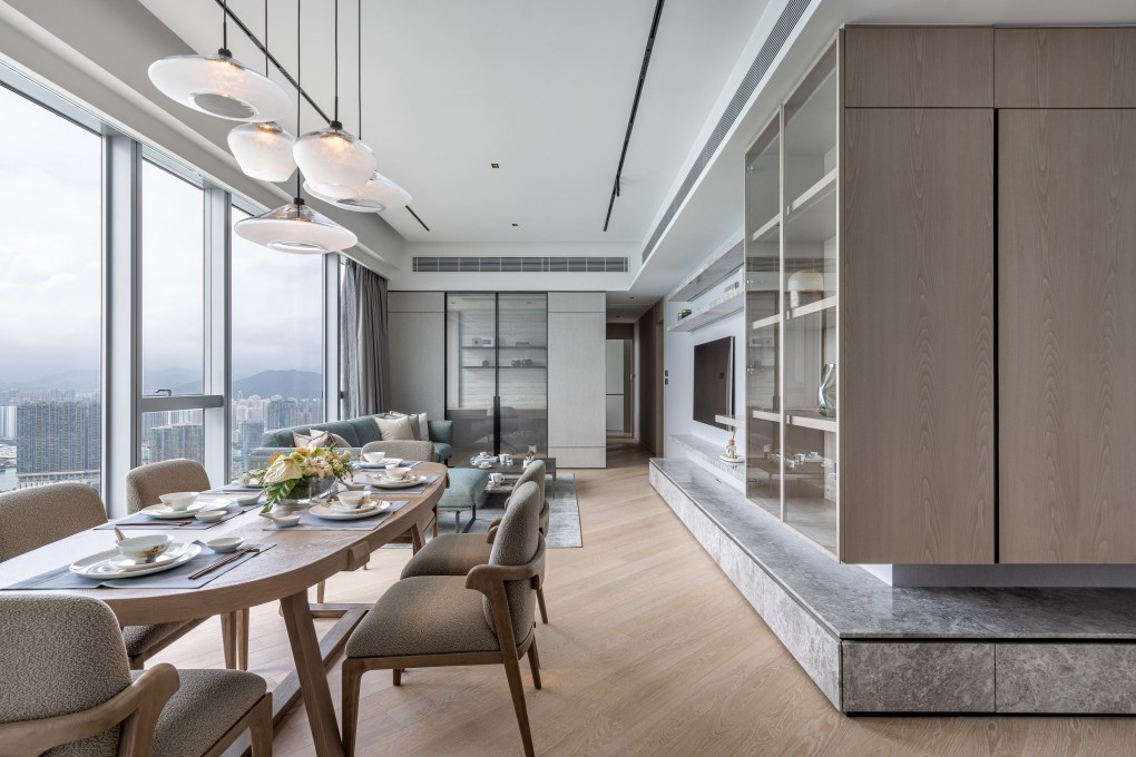 The living room was the focus of renovations for the new owners of a 77th-floor flat in Hong Kong. Modern contemporary furniture, high-end shelving and a khaki grey aesthetic ooze elegance. Photo: Dick Liu