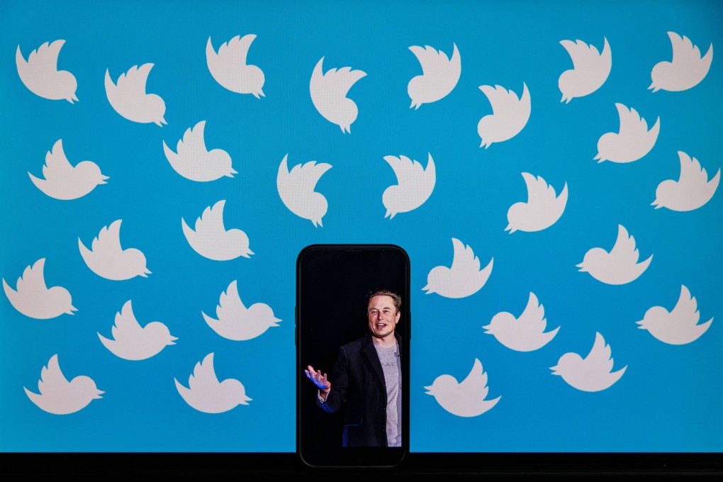 This illustration photo taken on August 5 shows a cellphone displaying a photo of Elon Musk placed on a computer monitor filled with Twitter logos in Washington. Photo: AFP