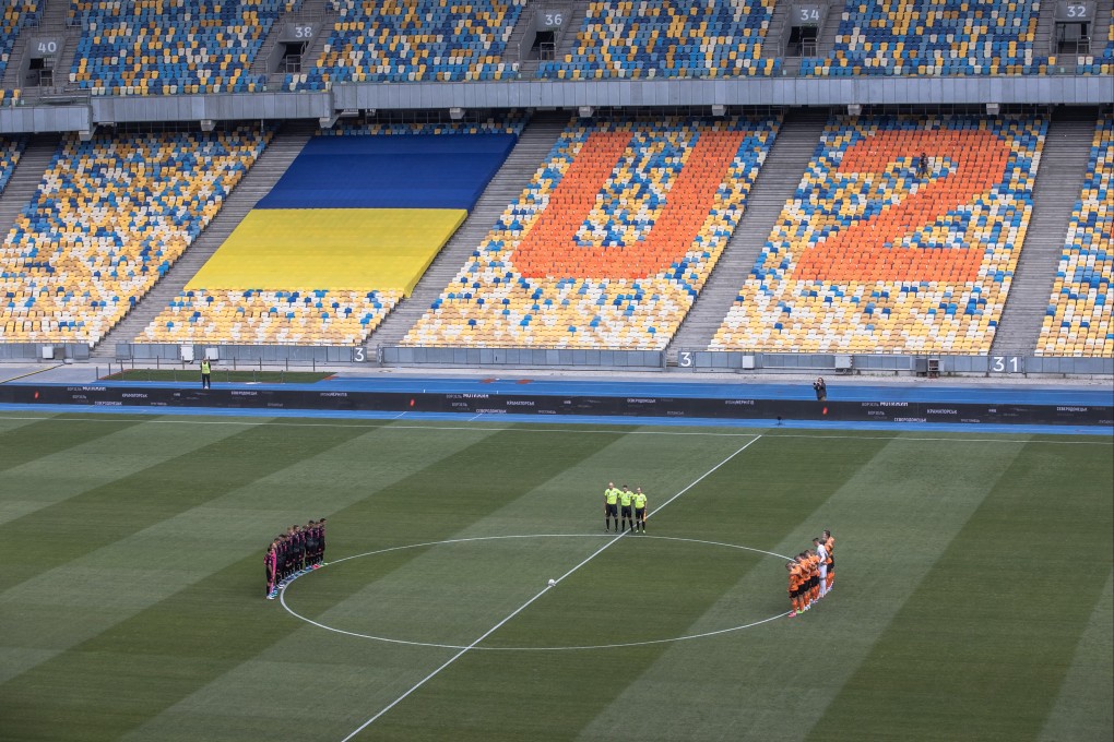 Players observe a minute of silence for those who were killed during the Russian invasion of Ukraine, before the opening soccer match of Ukrainian Premier League season. Photo: EPA-EFE