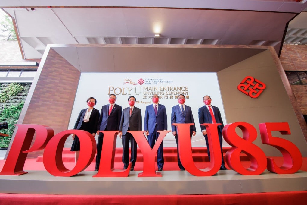 Hong Kong Chief Executive John Lee with Hong Kong Polytechnic University council chairman Dr Lam Tai-fai and other university representatives at the unveiling ceremony for PolyU’s new main entrance. Photo: PolyU
