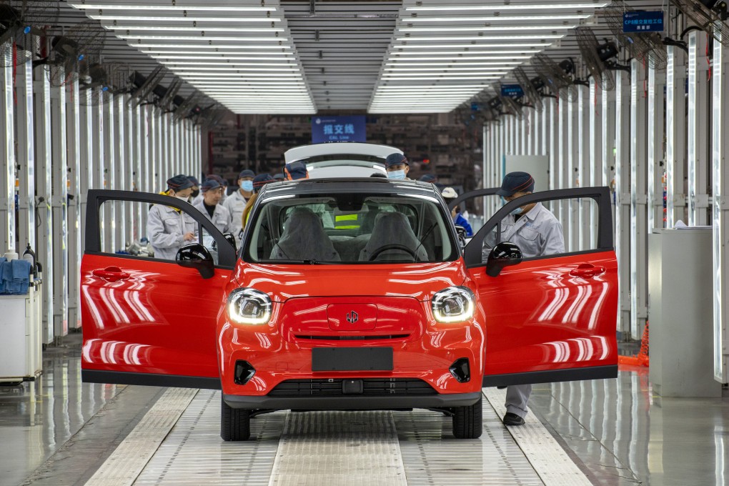 Employees work on the assembly line of the T03 electric car at a factory of Chinese EV maker Leapmotor on December 17, 2021 in Jinhua, Zhejiang Province. Photo: Getty Images